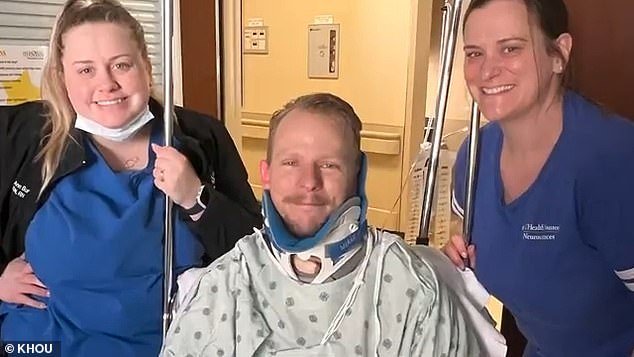Jared Hill, pictured with his care team, was flown to Memorial Hermann Medical Center in Houston nearly a week after his surfing accident in Tulum