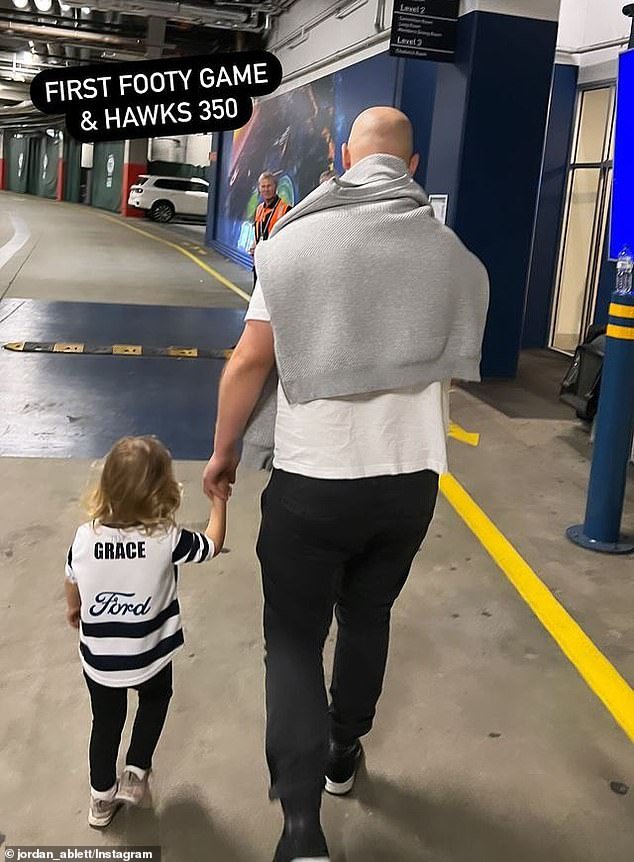 The former Geelong star, 39, took his two-year-old daughter Grace to the MCG on Monday to watch his old team take on Hawthorn.  Ablett's wife Jordan shared an adorable photo on Instagram of Gary walking around the stadium holding hands with his daughter