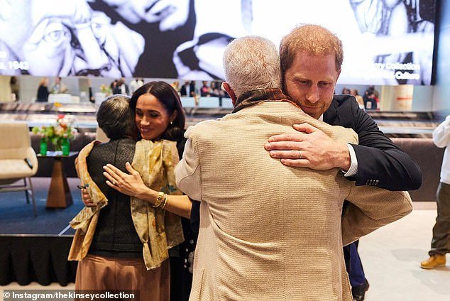 Hugs: The Duke and Duchess of Sussex were photographed hugging fellow presenters Bernard and Shirley Kinsley.