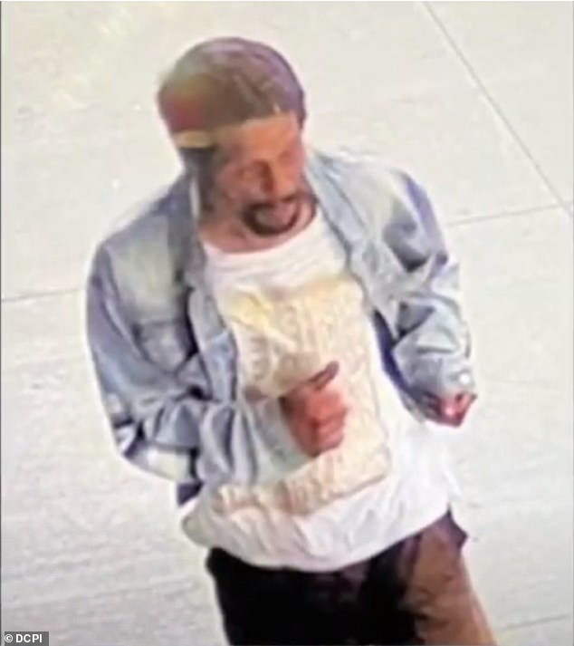 A close-up of the suspect who punched the 23-year-old in Chelsea.  Police have yet to arrest him, but he is described as having a medium build and medium complexion