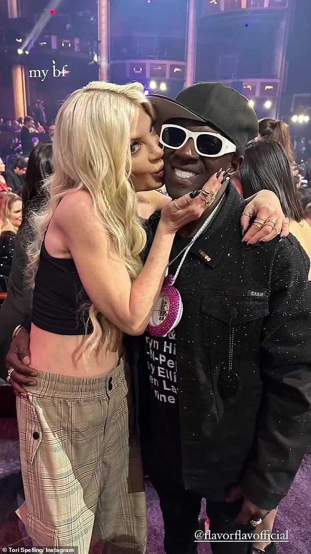 The outing comes after Tori shared a photo of her kissing rapper Flavor Flav, 65, on the cheek at the iHeartRadio Music Awards earlier this week, calling him her “new boyfriend”