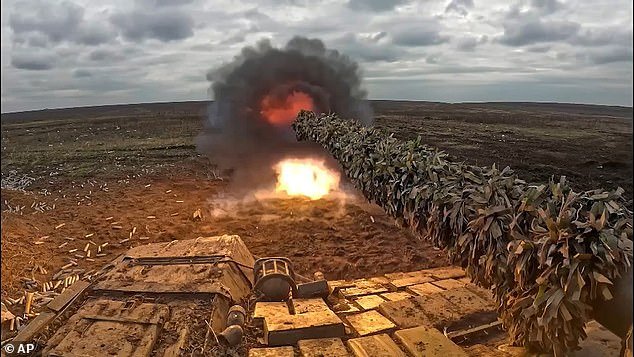 In this photo taken from a video and released by the press service of the Russian Ministry of Defense on Thursday, April 4, 2024, a Russian tank fires at a secret location in Ukraine