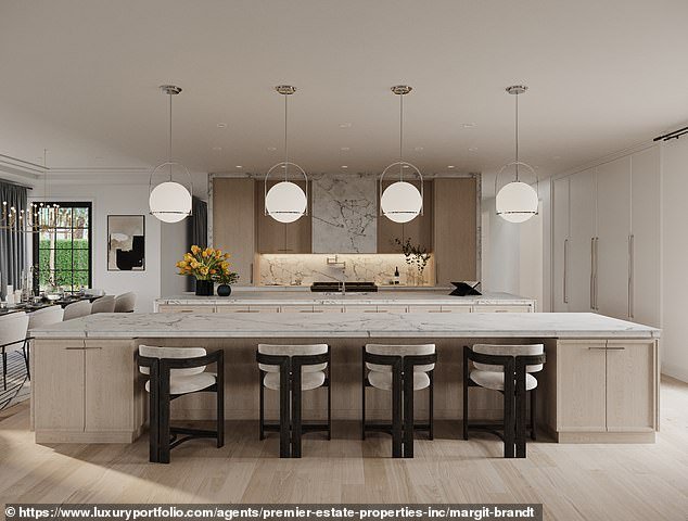 “The property offers true resort style, including impressive in-home health and wellness amenities,” the listing said.  In the photo: the kitchen of the building with a cuddly island
