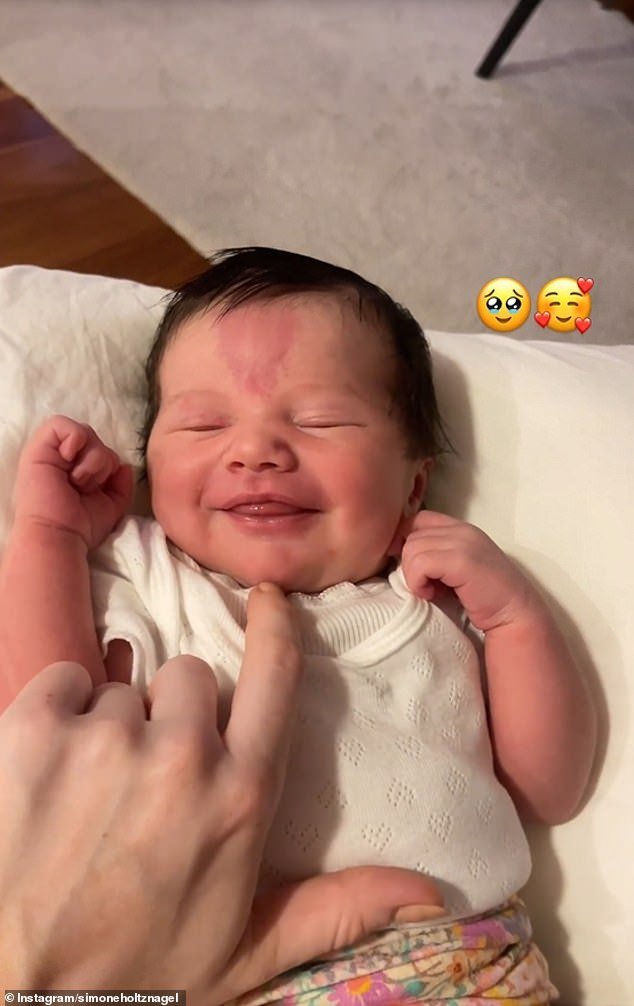 Hours earlier, Simone shared a heartwarming close-up video of Gia smiling in her crib while being tickled by her loving mother