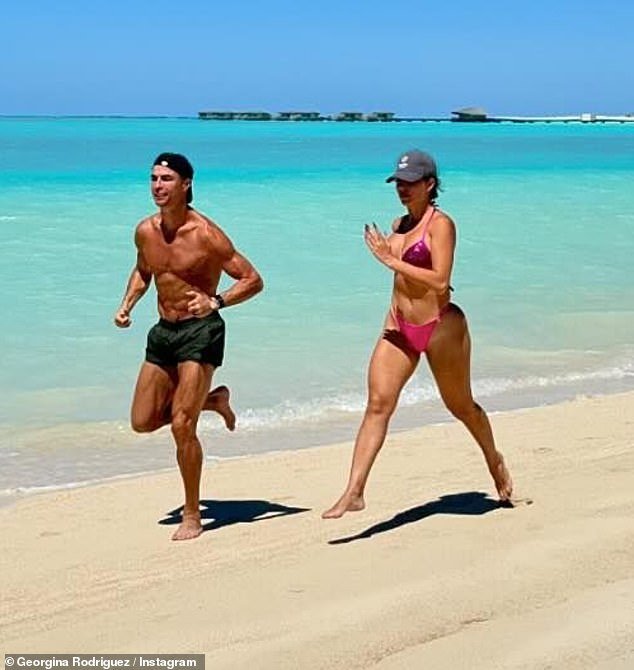 She and the football icon were photographed taking a grueling beach walk along the coastline, as they both showed off their incredibly toned figures