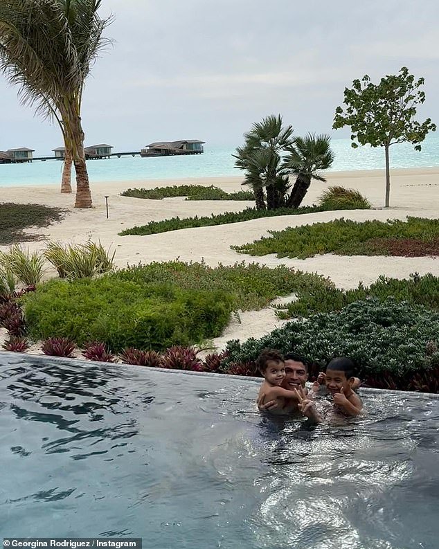 The Portuguese footballer beamed as he hugged two of his sons while swimming in a beautiful infinity pool