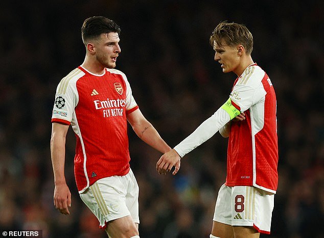 At Arsenal, the youngster would join a formidable midfield alongside Declan Rice (left) and Martin Odegaard