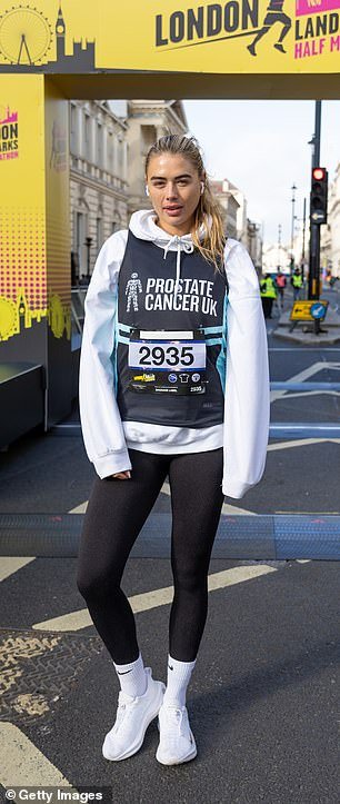 Arabella Chi, 33, wore no makeup and wore a casual white hoodie and matching sneakers for the race