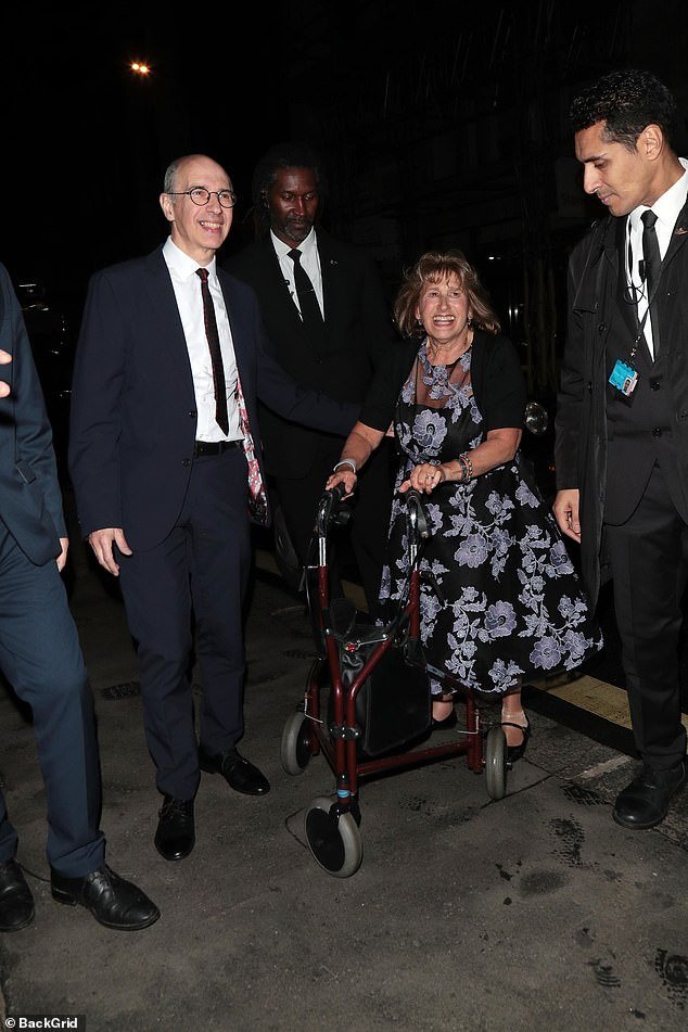 Meanwhile, Janis, 69, who has been diagnosed with multiple sclerosis, looked stunning in a floral dress as she walked to the party with the help of a frame