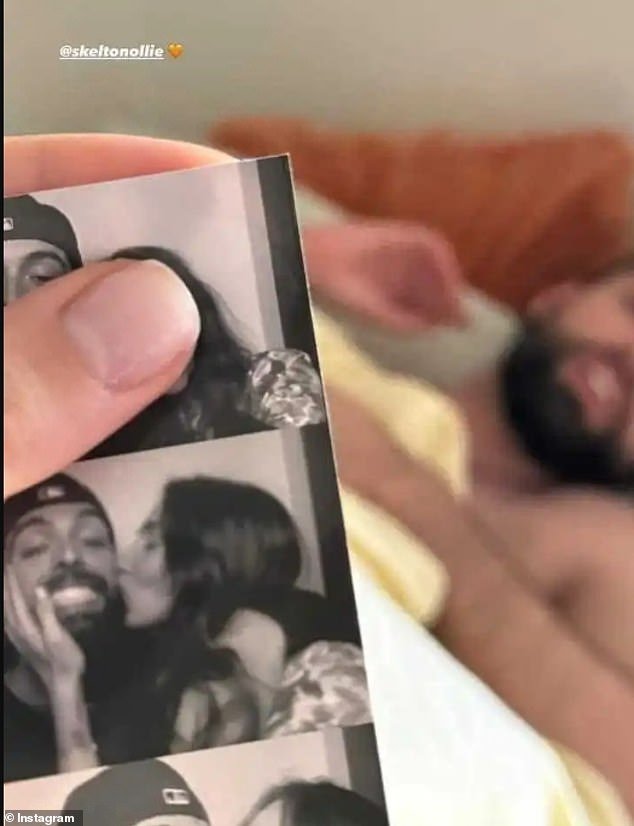 One sweet photo captured Nadia's hand as she held a photo booth kissing his cheek as Ollie leaned back in the background