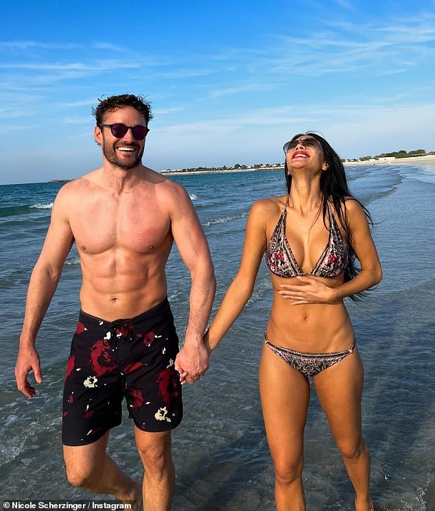 Nicole celebrated her fiancé Thom Evans' birthday on Thursday with a slew of beach snaps as she thanked him for 'keeping her smiling'
