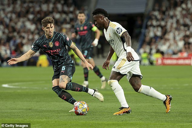 Stones (pictured left against Vinicius Jr) suffered the lowest year of his career in 2020 as he was consistently overlooked and fell down the pecking order