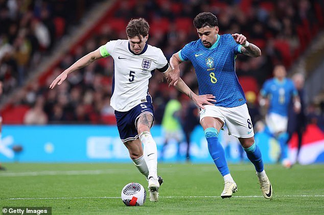 Stones played for England in their international friendly against Brazil in March (above)