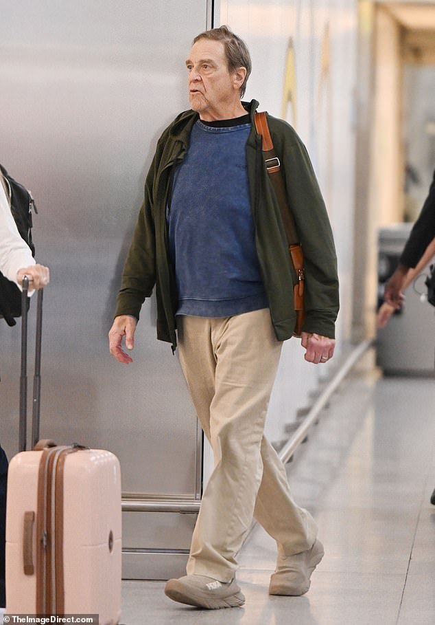 The 71-year-old actor was dressed in a dark green sweatshirt, khaki pants and matching Hoka sneakers