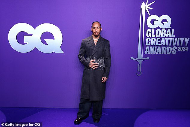 He appeared in his element as he posed on the purple carpet