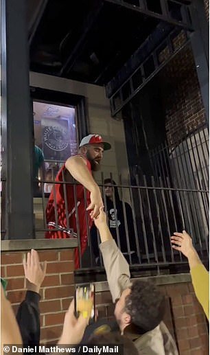 Jason Kelce is seen shaking hands with some members of his former fraternity, Sigma Sigma