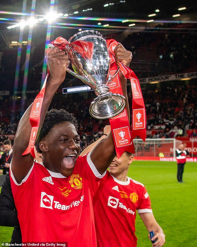 Kobbie Maino celebrates after Manchester United's victory in the final at Old Trafford in 2022