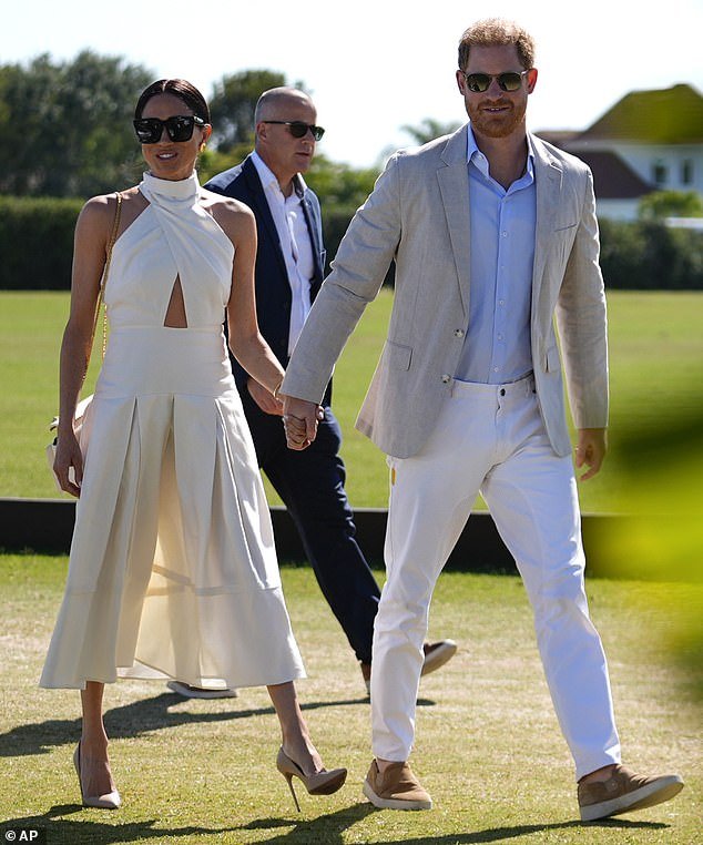 The Duchess of Sussex, 42, braved the grassy grounds in a pair of sky-high nude heels that put her at serious risk of sinking into the ground beneath her