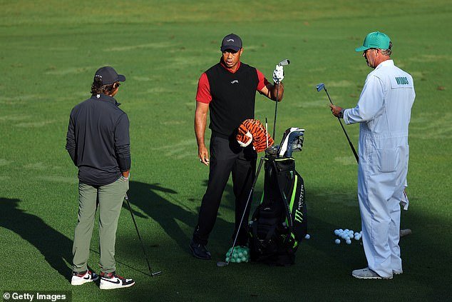 Tiger Woods talks to his son Charlie and his caddy Lance Bennett before the final round