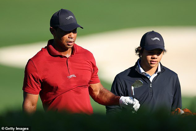 Tiger and Charlie Woods are seen in the Augusta warm-up room wearing their father's clothing line