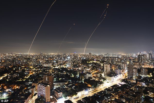 Israel's Iron Dome air defense system fires to intercept a rocket fired from the Gaza Strip, in central Israel, in November 2023