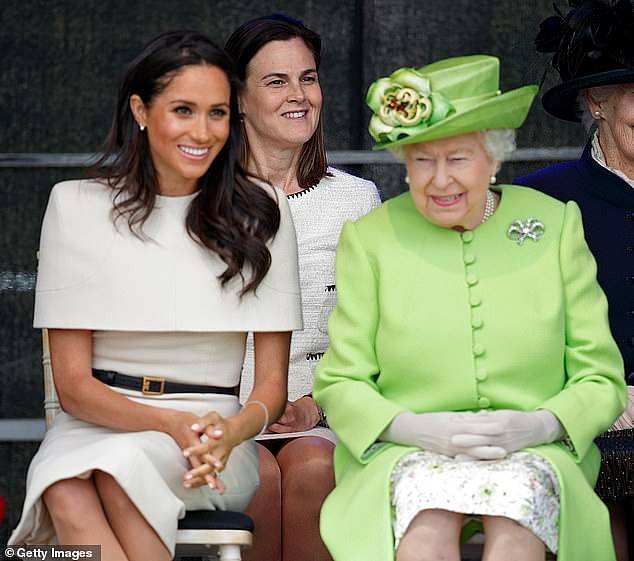 Ms Cohen sits behind The Queen and Meghan Markle at an event (pictured)