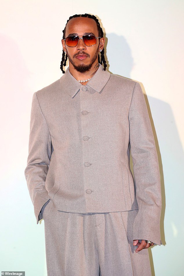 The F1 driver, 39, an ambassador for the German luggage brand, looked stylish in a gray oversized button-up shirt, teamed with matching wide-leg trousers