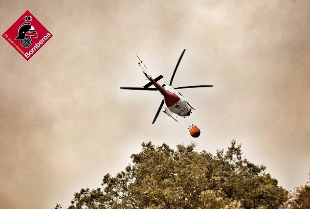 On Monday, a helicopter was busy extinguishing fires in eastern Spain