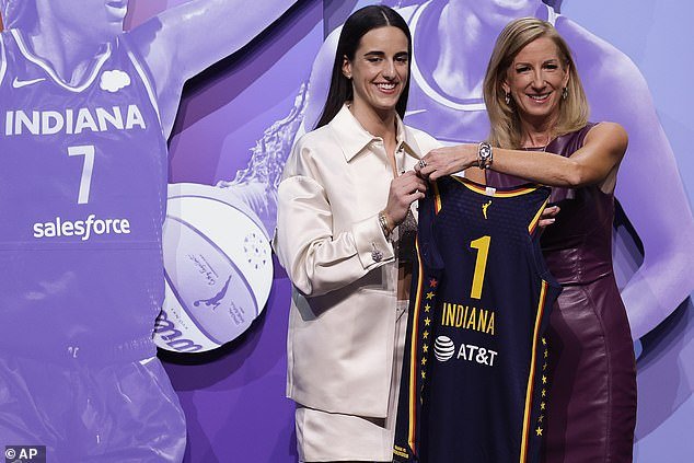 Iowa's Caitlin Clark, left, poses for a photo with WNBA Commissioner Cathy Engelbert