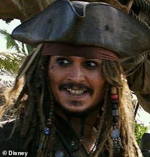 Johnny is known for transforming his smile depending on the roles he plays.  For Pirates of the Caribbean, he had an elaborate gold covering for his teeth