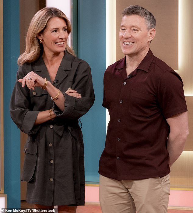 Cat's co-host Ben wore a smart-casual look for the show as he wore a burgundy shirt and beige trousers