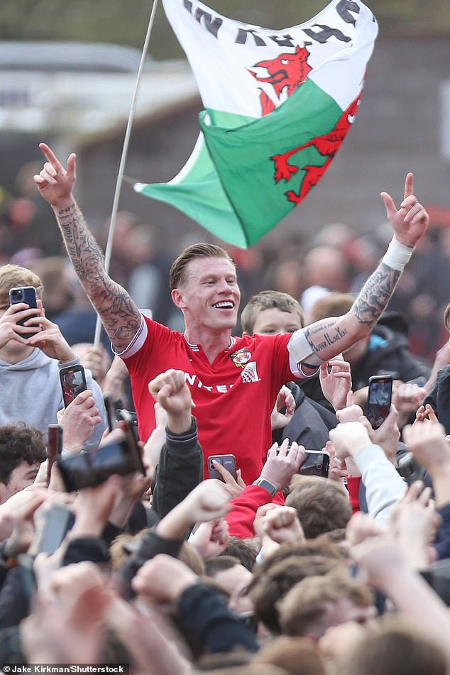 McClean celebrated with the Wrexham fans after they earned promotion this weekend