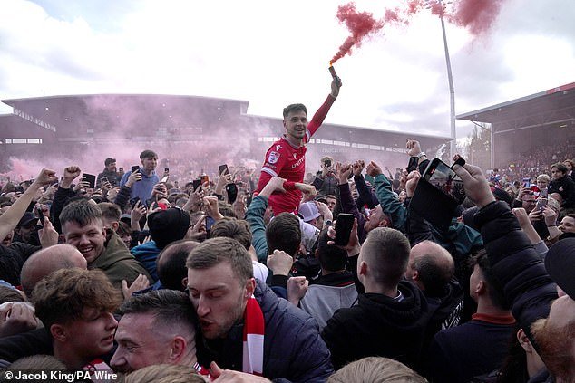Delighted fans ignored a warning from the club and stormed the field after the match