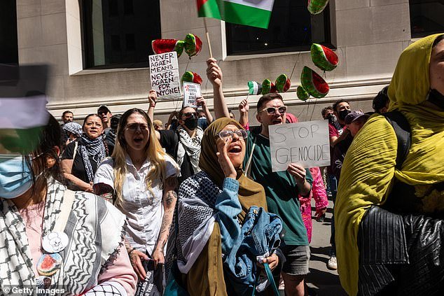 Pro-Palestinian demonstrators confront a small group of Israeli demonstrators during dueling events outside the New York Stock Exchange