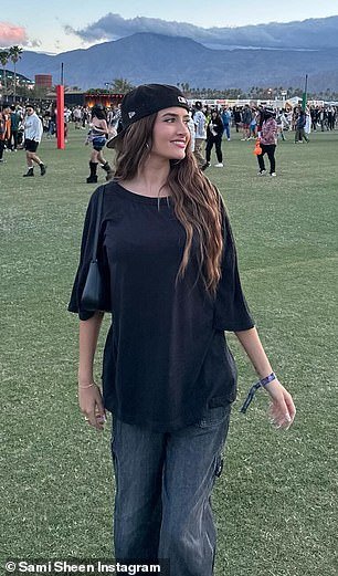 The 20-year-old OnlyFans model covered up her figure as she wore an oversized black T-shirt and baggy jeans with cargo pockets
