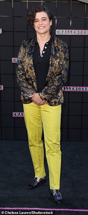 Katy O'Brian, 35, showed off her unique sense of style in bright lime green pants, a black top and a metallic gold and black blazer