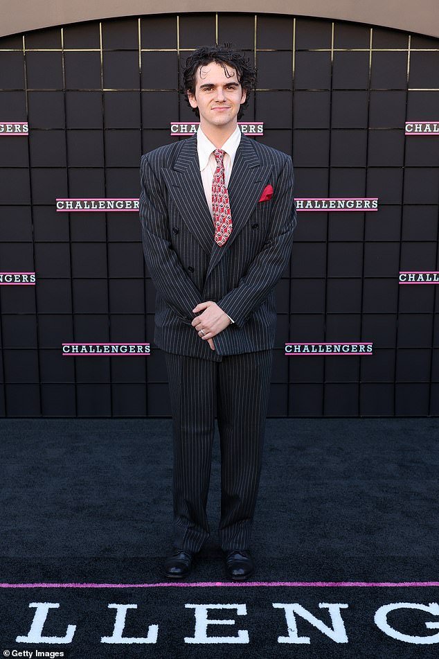 Jack Dylan Grazer, 20 – famous for his role in horror IT – looked dapper in a pinstripe suit and red tie