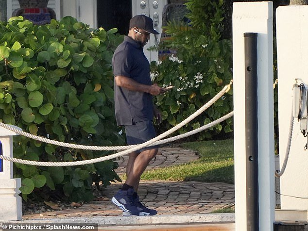 Diddy walked along the dock of his Star Island mansion
