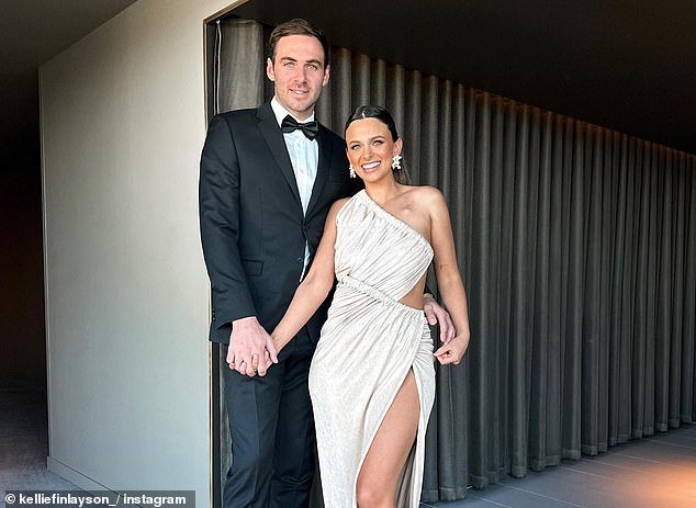 Finlayson (pictured with his wife Kellie) was given a three-week suspension for homophobic comments