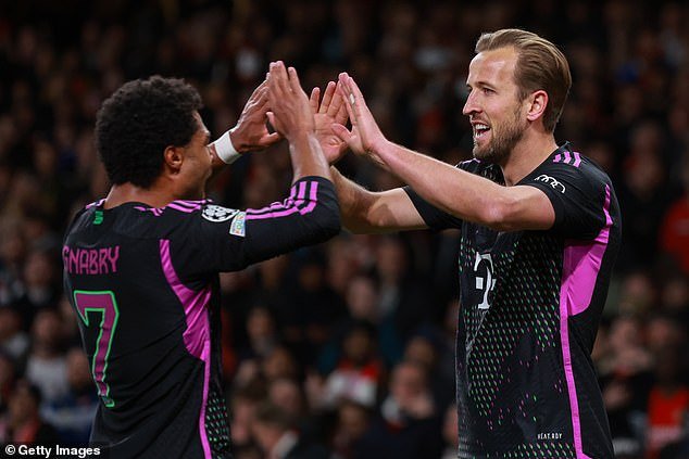 Harry Kane (right) scored as the Bundesliga giants secured a 2-2 draw at the Emirates