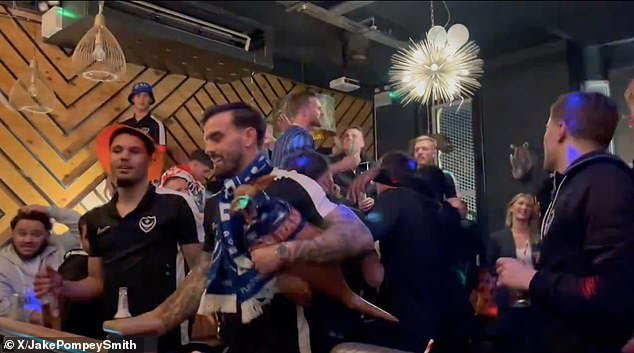 The Pompey players joined the fans in singing along to Oasis' Wonderwall after securing promotion to the Championship as League One winners