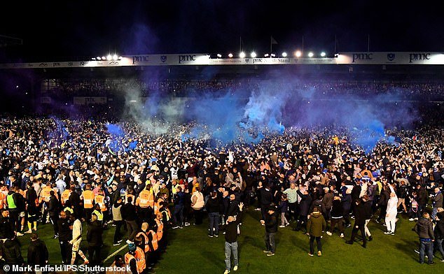 Thousands of supporters stormed Fratton Park at full time to celebrate the promotion win