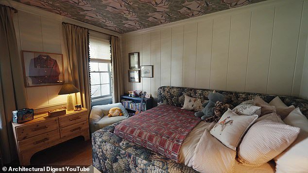 Rhodes' forest-themed room features wallpaper with flying ducks on the ceiling