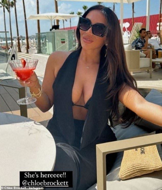 The former TOWIE star, 23, made the most of the sun after the desert city-state suffered horrific flooding on Tuesday