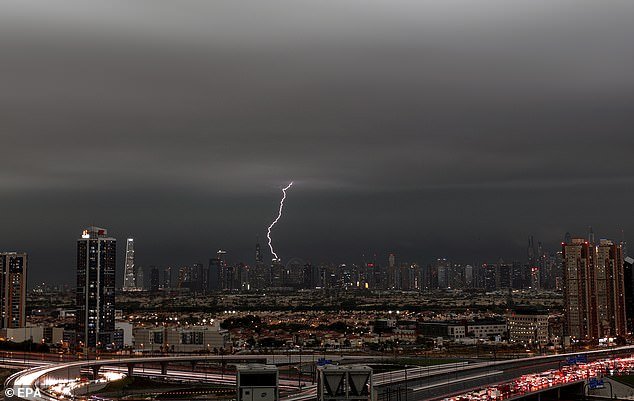 Lightning flashes across the sky during a heavy rain in Dubai, April 16, 2024