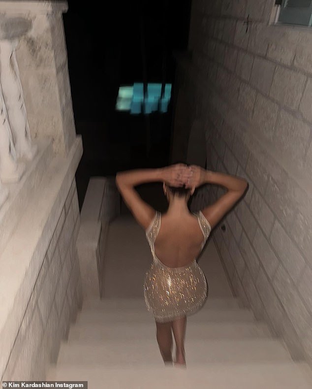 Sharing a slew of envy-inducing snaps of herself in a plunging gold minidress from their luxurious trip, the reality star, 43, credited her eldest child for capturing the moment