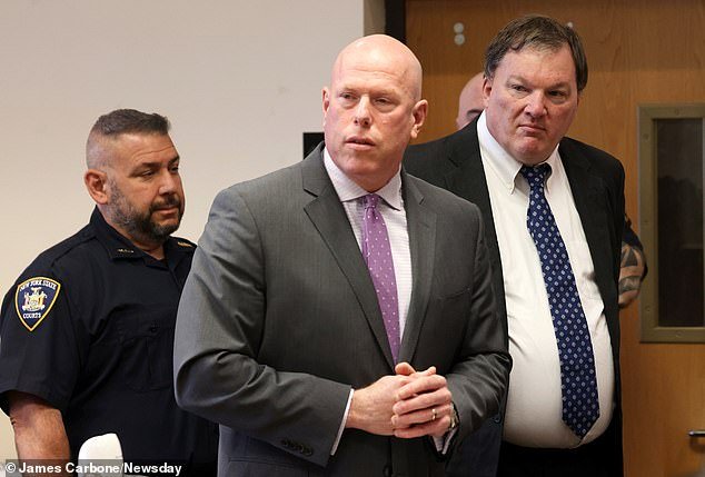 Alleged Gilgo Beach serial killer Rex A. Heuermann, right, appears in Judge Tim Mazzei's courtroom next to his attorney Michael Brown in Suffolk County Court in Riverhead on Wednesday