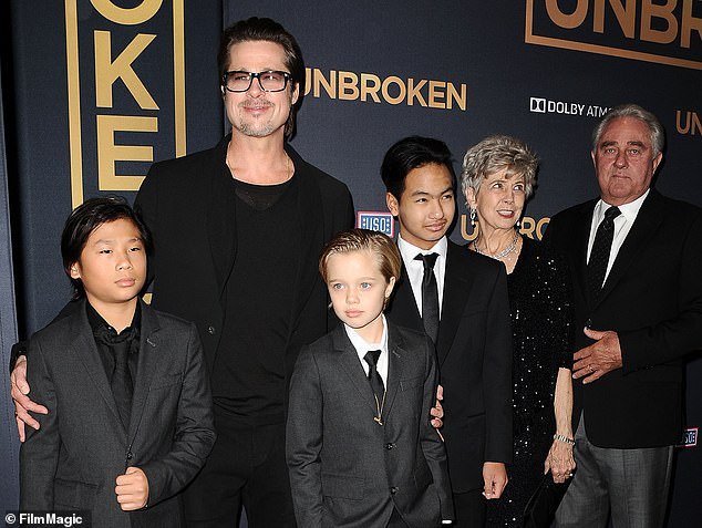 According to sources, Pitt (pictured with three of his children and his parents in 2014) has earned nearly $10 million in child support over the years