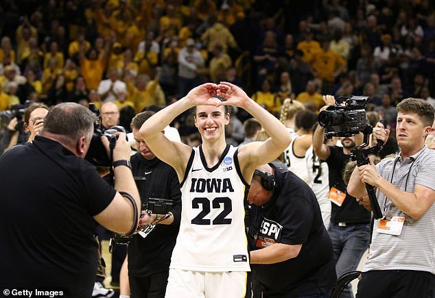 The gesture Clark makes at the end of games can be seen here, as the former Iowa star smiles