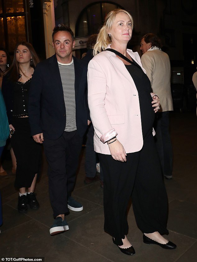 With a smile, Anne-Marie looked chic in a pink blazer paired with black pants and flat pumps for date night